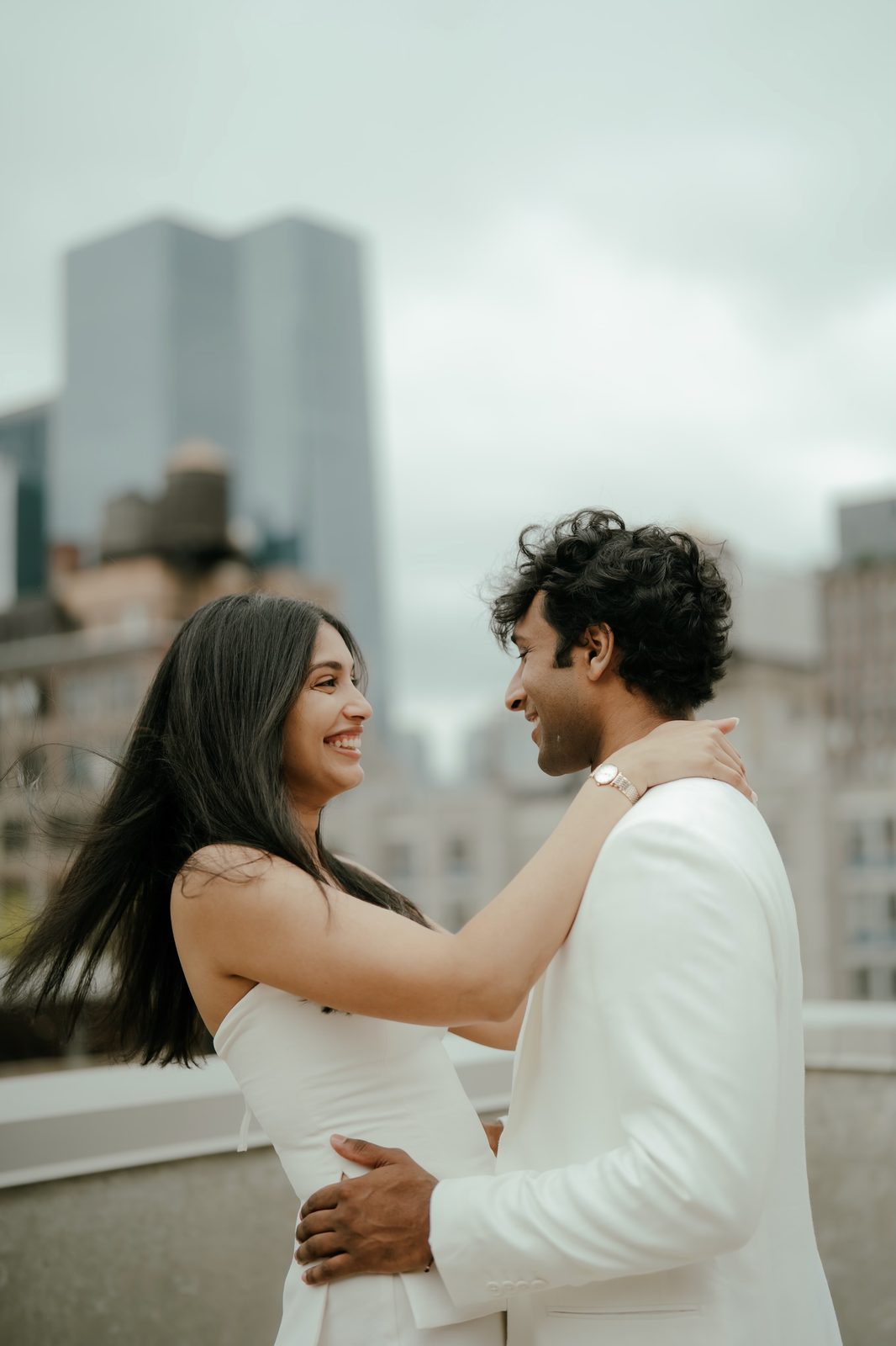Rooftop embrace, New York behind